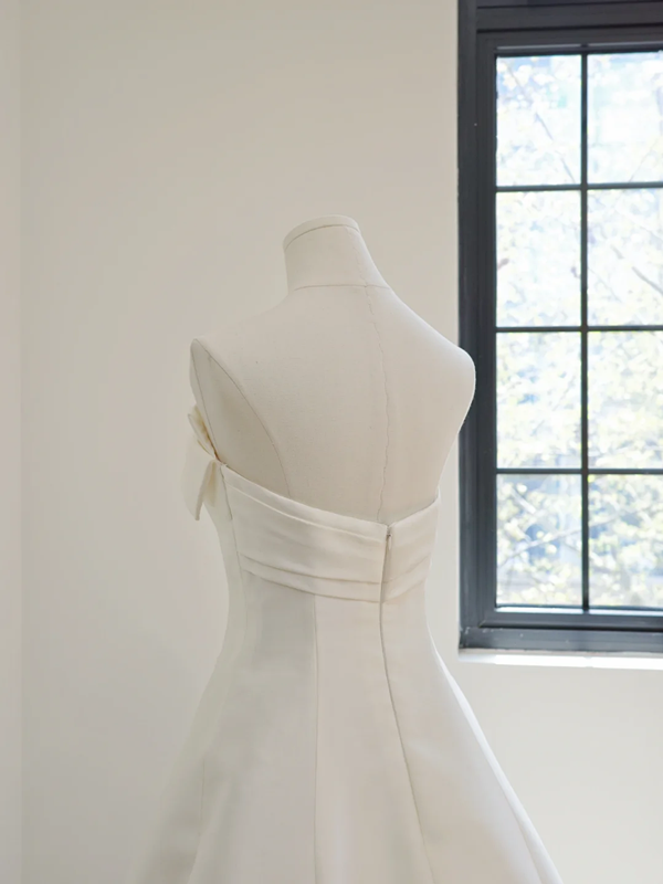 White strapless, fitted, long ball gown with a full skirt; bridal gown R8501