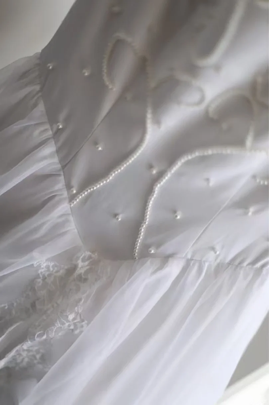 White fitted long ball gown with beaded details exudes elegance R6690