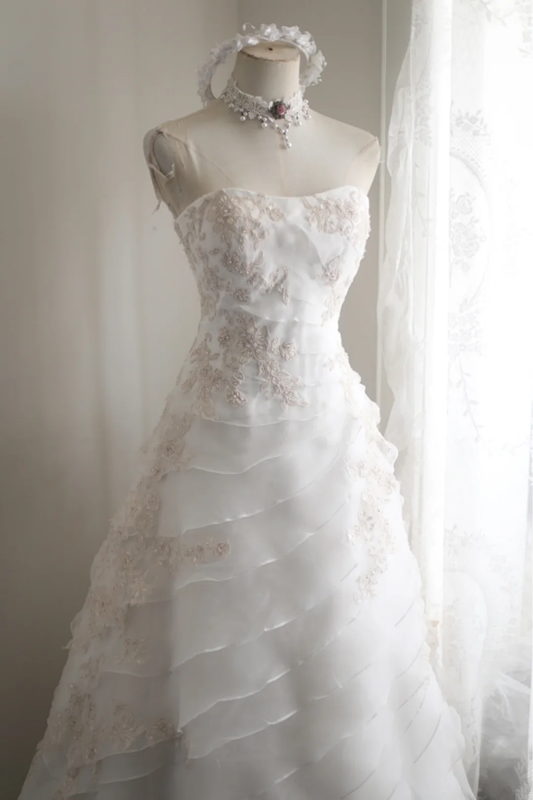 White strapless embroidered A-line ball gown with a fitted waist and full skirt R6771