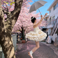 Light apricot strapless fitted waist short ball gown with a flared tiered skirt R8027