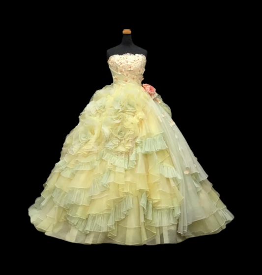 Light yellow strapless ball gown with a cinched waist and a voluminous puffy skirt; bridal gown R7287