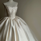 White strapless, waist‑cinching, vintage‑patterned, long ball gown with a fluffy skirt, wedding dress R8002