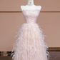 Light pink strapless, fitted waist, long ball gown with feather skirt design; bridal gown R8345