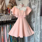 Light pink A-line short ball gown with ruffled neckline and fitted waist R7500