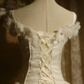 White off-the-shoulder floor-length ball gown with a cinched waist, slim fit and voluminous puffy skirt; bridal gown R7293
