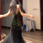 Sexy ball gown with black halter neck, fitted waist, and sequined fishtail skirt. R8065