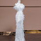 White strapless, fitted, sexy long ball gown with feather design; bridal gown R8320
