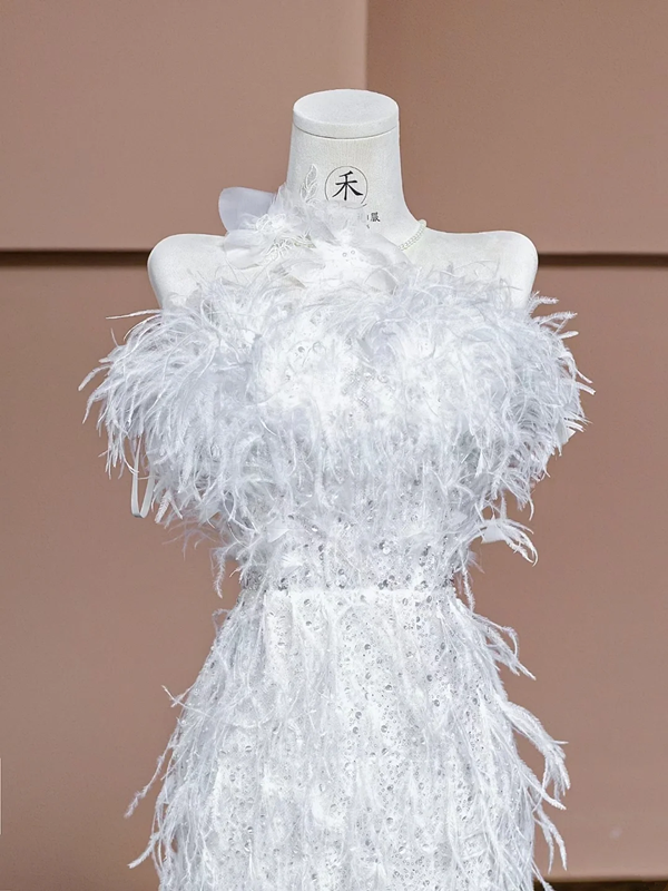 White strapless, fitted, sexy long ball gown with feather design; bridal gown R8320