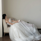 White strapless waist‑cinched slim‑fit ball gown with a full ruffled skirt, wedding dress R8008