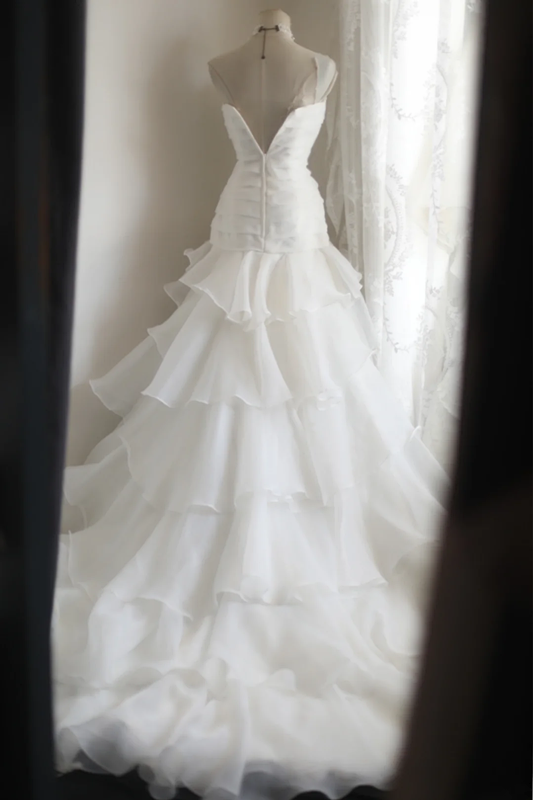 White strapless, fitted, long ball gown with a tiered skirt; bridal gown R6822