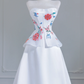 White strapless beaded floral dress with a fitted waist, A-line silhouette, and long ball gown R8243