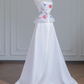 White strapless beaded floral dress with a fitted waist, A-line silhouette, and long ball gown R8243