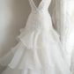 White strapless, fitted, long ball gown with a tiered skirt; bridal gown R6822
