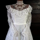 White lace square-neck long-sleeve ball gown with a cinched waist, vintage style and tiered cake skirt; bridal gown R7295