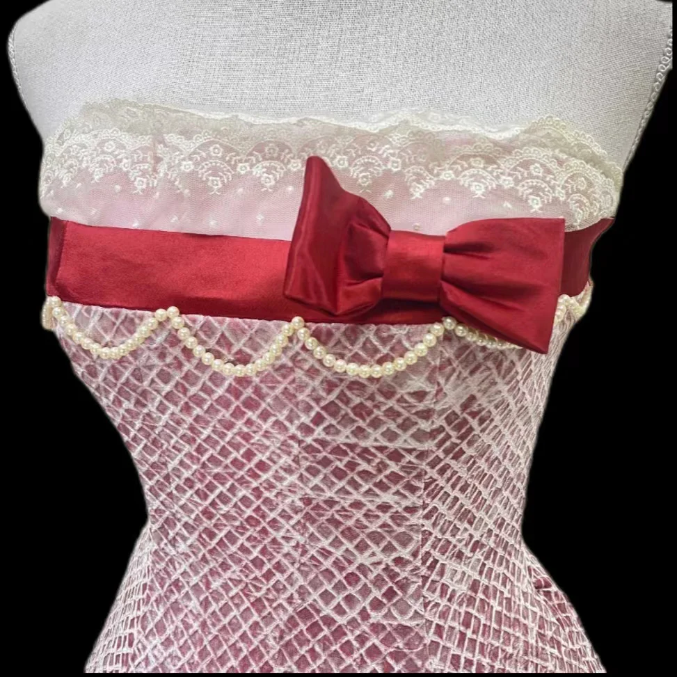 Pink strapless ball gown with a cinched waist and an A-line skirt; bridal gown R7296