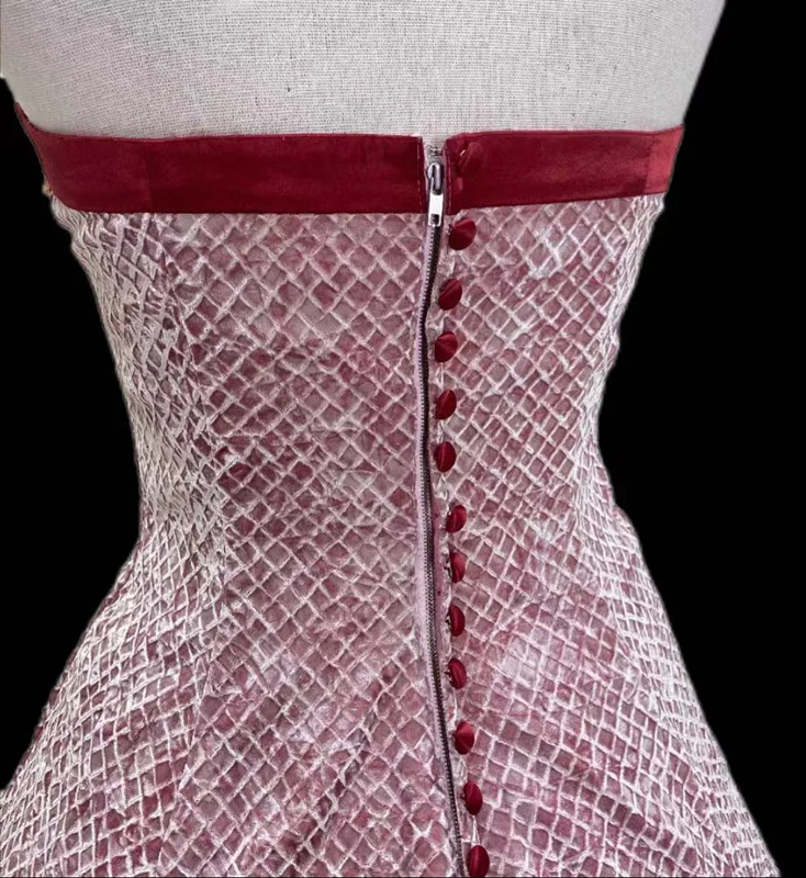 Pink strapless ball gown with a cinched waist and an A-line skirt; bridal gown R7296