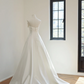 White strapless, fitted, long ball gown with a full skirt; bridal gown R8501