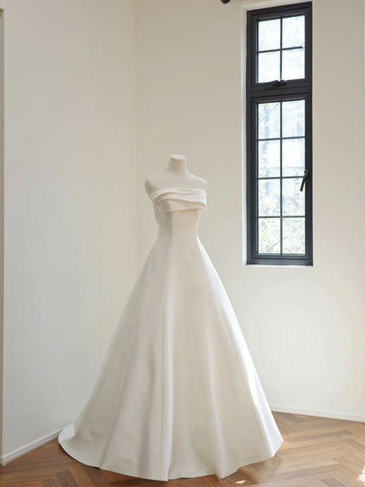 White strapless, fitted, long ball gown with a full skirt; bridal gown R8501