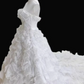 White strapless ball gown with a cinched waist and a voluminous tiered cake skirt; bridal gown R7300