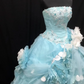 Light blue strapless ball gown with a cinched waist and a voluminous puffy skirt; bridal gown R7301