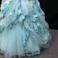 Light blue strapless ball gown with a cinched waist and a voluminous puffy skirt; bridal gown R7301