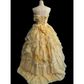 Light orange strapless ball gown with a cinched waist and a voluminous tiered cake skirt; bridal gown R7302