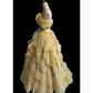 Light orange strapless ball gown with a cinched waist and a voluminous tiered cake skirt; bridal gown R7302