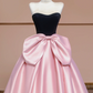 Black strapless bodice with a fitted waist and pink tulle skirt, a ball gown/bridal dress R8359