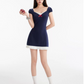 Edgy Preppy Navy Blue Mini Dress With Form-Fitting Silhouette And Red Bow Accent R9311