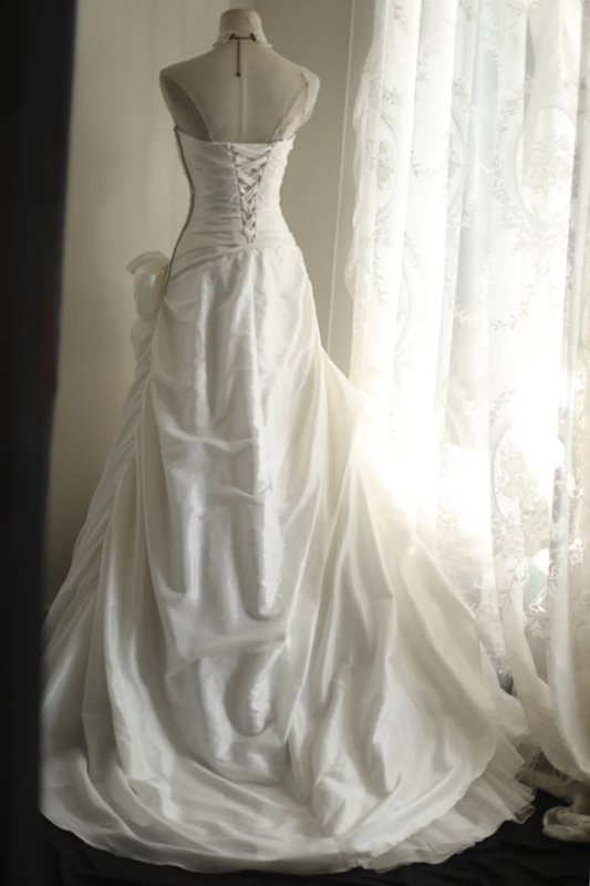 White strapless fitted satin ball gown with a full skirt and cinched waist R6796