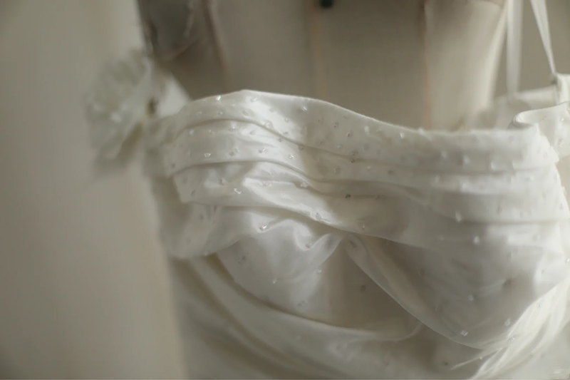 White strapless fitted satin ball gown with a full skirt and cinched waist R6796