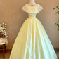 Light yellow crew-neck floor-length ball gown with a cinched waist and slim fit; bridal gown R7310