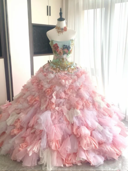 Sexy pink tulle ball gown with a fitted waist, strapless neckline, and elaborate tulle skirt R6482