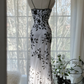 White dress with black floral print, halter neck, fitted waist, elegant long ball gown R7678