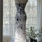 White dress with black floral print, halter neck, fitted waist, elegant long ball gown R7678
