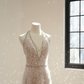 A sexy ball gown with a silver rhinestone halter neck and fitted waist, featuring a foundation and a bridal gown. R8550