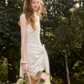 White Ruched Cami Mini Dress with Eyelet Lace Trim, Bow Tie Detail and Asymmetric Hem R9259