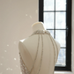 A sexy ball gown with a silver rhinestone halter neck and fitted waist, featuring a foundation and a bridal gown. R8550