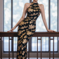 Black and gold floral print sleeveless long ball gown with a fitted waist R7527