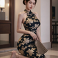 Black and gold floral print sleeveless long ball gown with a fitted waist R7527