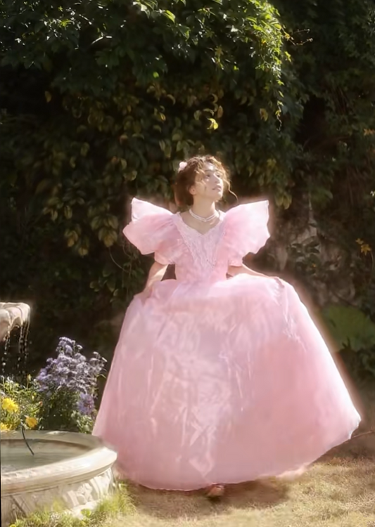 Pink floor-length ball gown with a cinched waist and slim fit, exuding elegance; bridal gown R7280