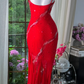 Red halter-neck fitted long ball gown with an asymmetrical hem R7680