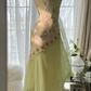 Light yellow-green halter-neck fitted long ball gown with an asymmetrical hem R7679