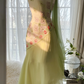 Light yellow-green halter-neck fitted long ball gown with an asymmetrical hem R7679