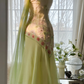 Light yellow-green halter-neck fitted long ball gown with an asymmetrical hem R7679