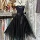 Black strapless, fitted waist, short ball gown with an asymmetrical hem R7483