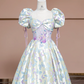 Off-white base with light purple butterfly print, fitted waist, long ball gown with a full skirt R8337