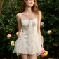White Corset-Style Mini Dress with Lace-Up Front, Tulle Ruffle Skirt, and Thin Spaghetti Straps R9257