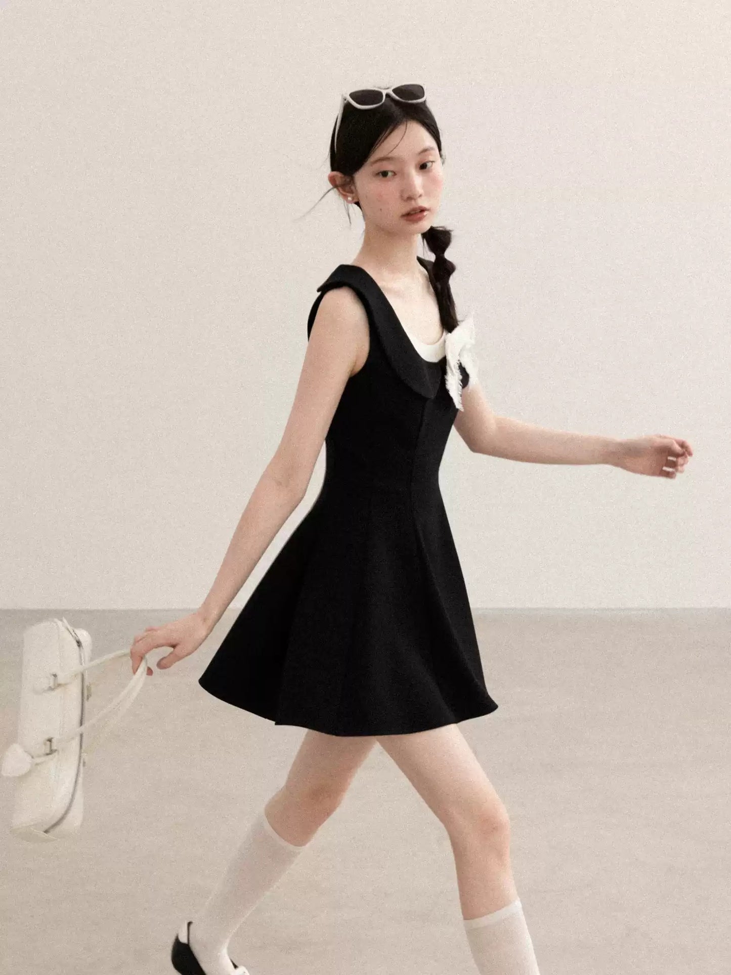 Black Sleeveless A-Line Dress with White Bow Accent R9171