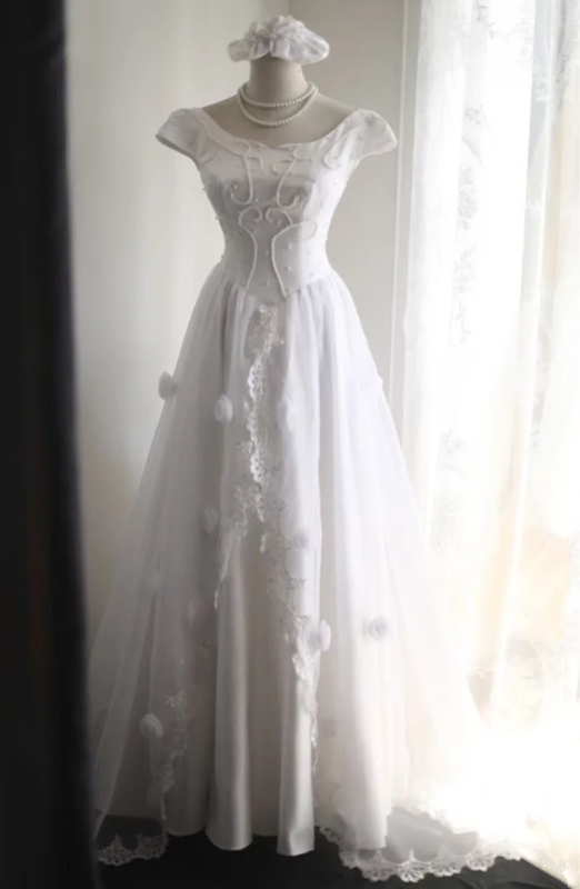 White fitted long ball gown with beaded details exudes elegance R6690